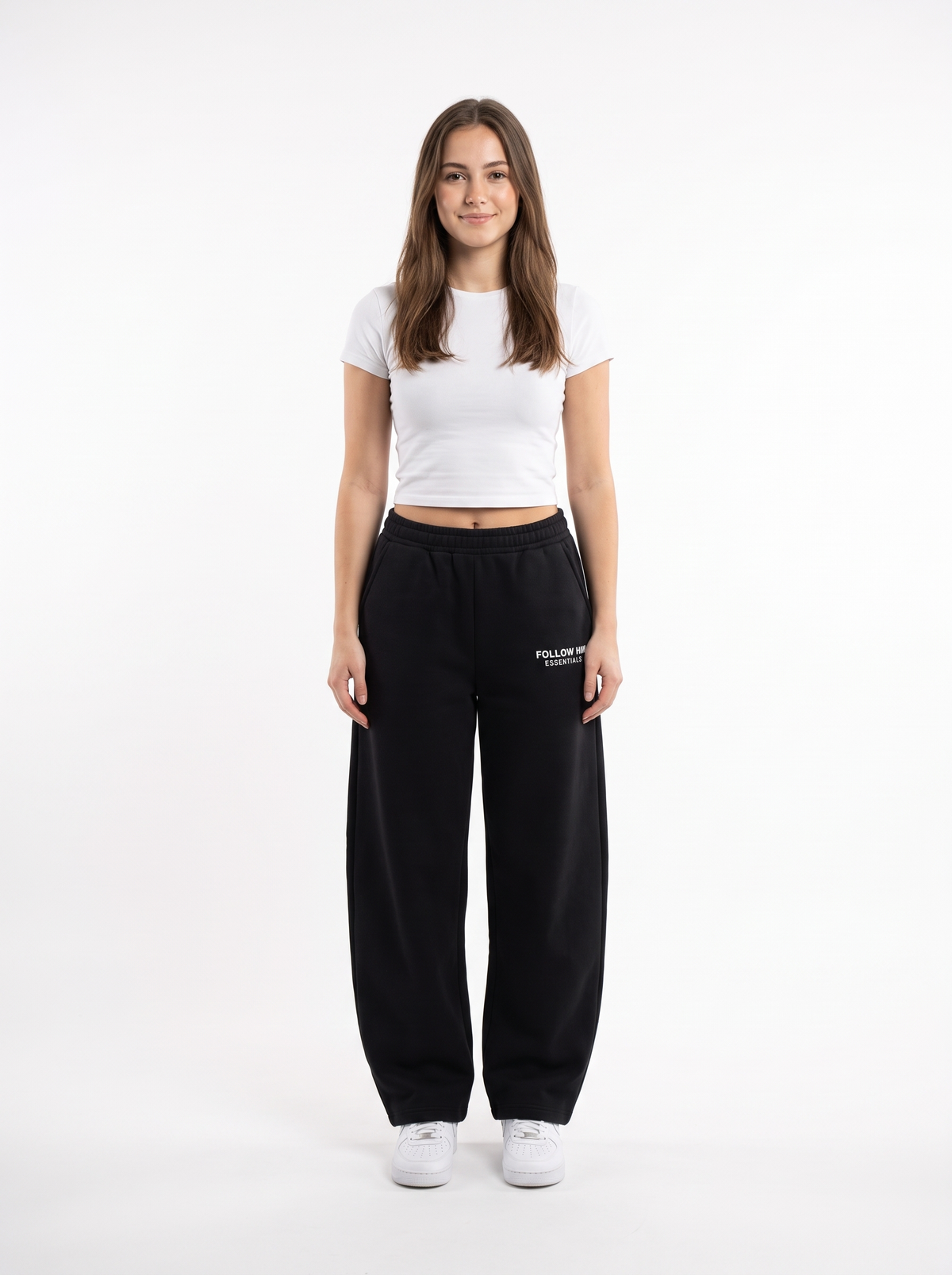Woman wearing black barrel leg sweatpants