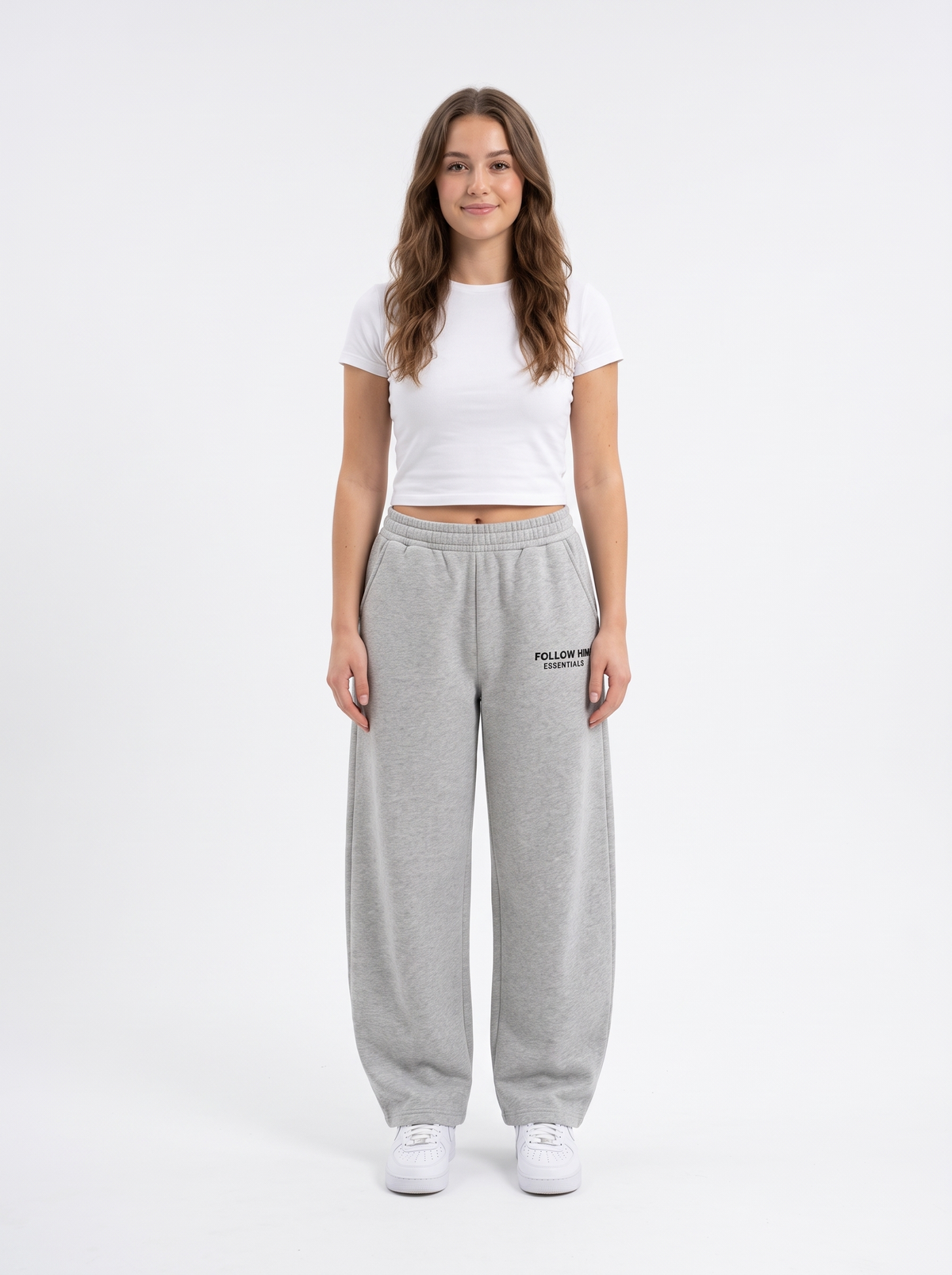 Woman wearing gray barrel leg sweatpants