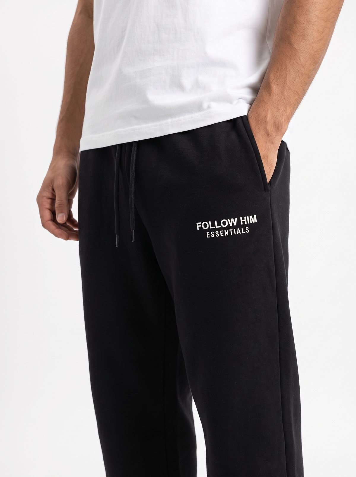 Black sweatpants thigh logo close-up