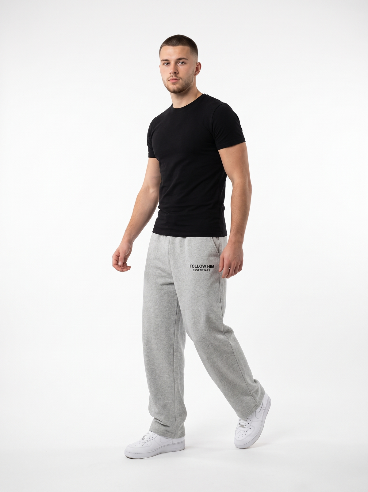 Man walking in gray barrel leg sweatpants