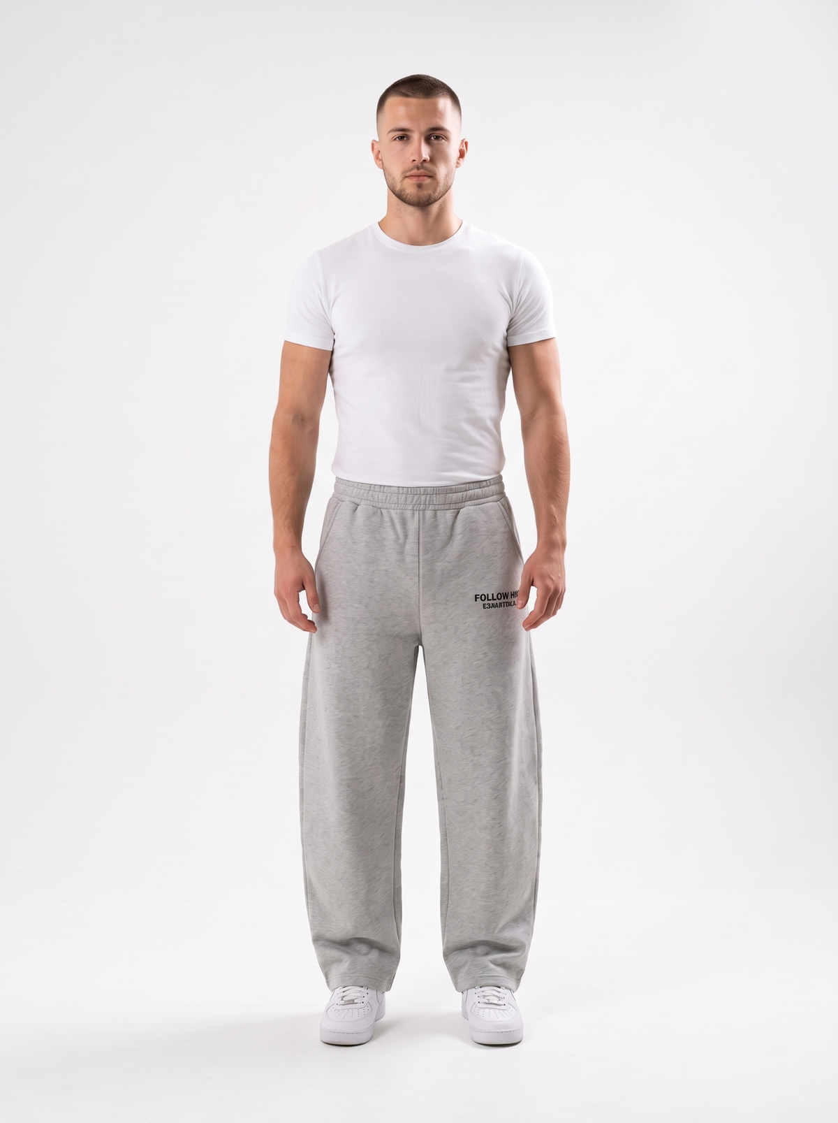 Man wearing gray barrel leg sweatpants