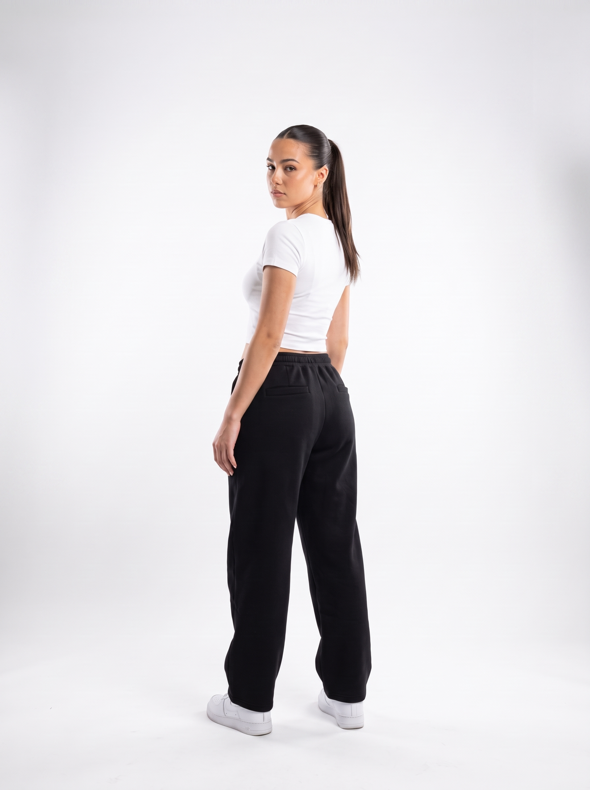 Black barrel leg sweatpants, back view